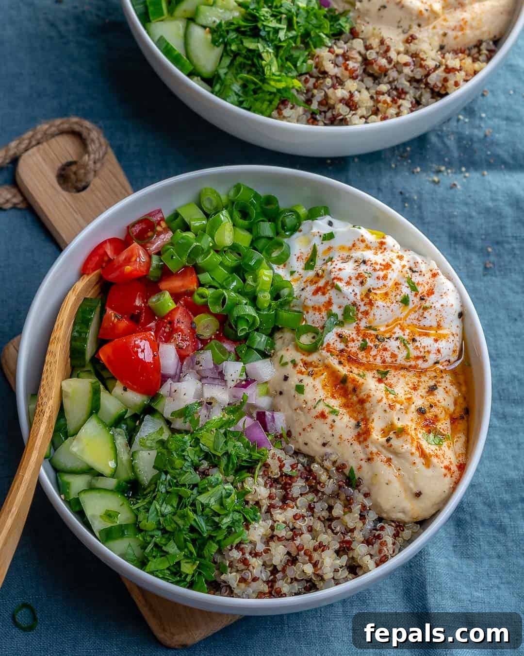 Plant-Powered Quinoa and Hummus Bowl 4 A bowl of creamy homemade hummus, garnished with olive oil and paprika