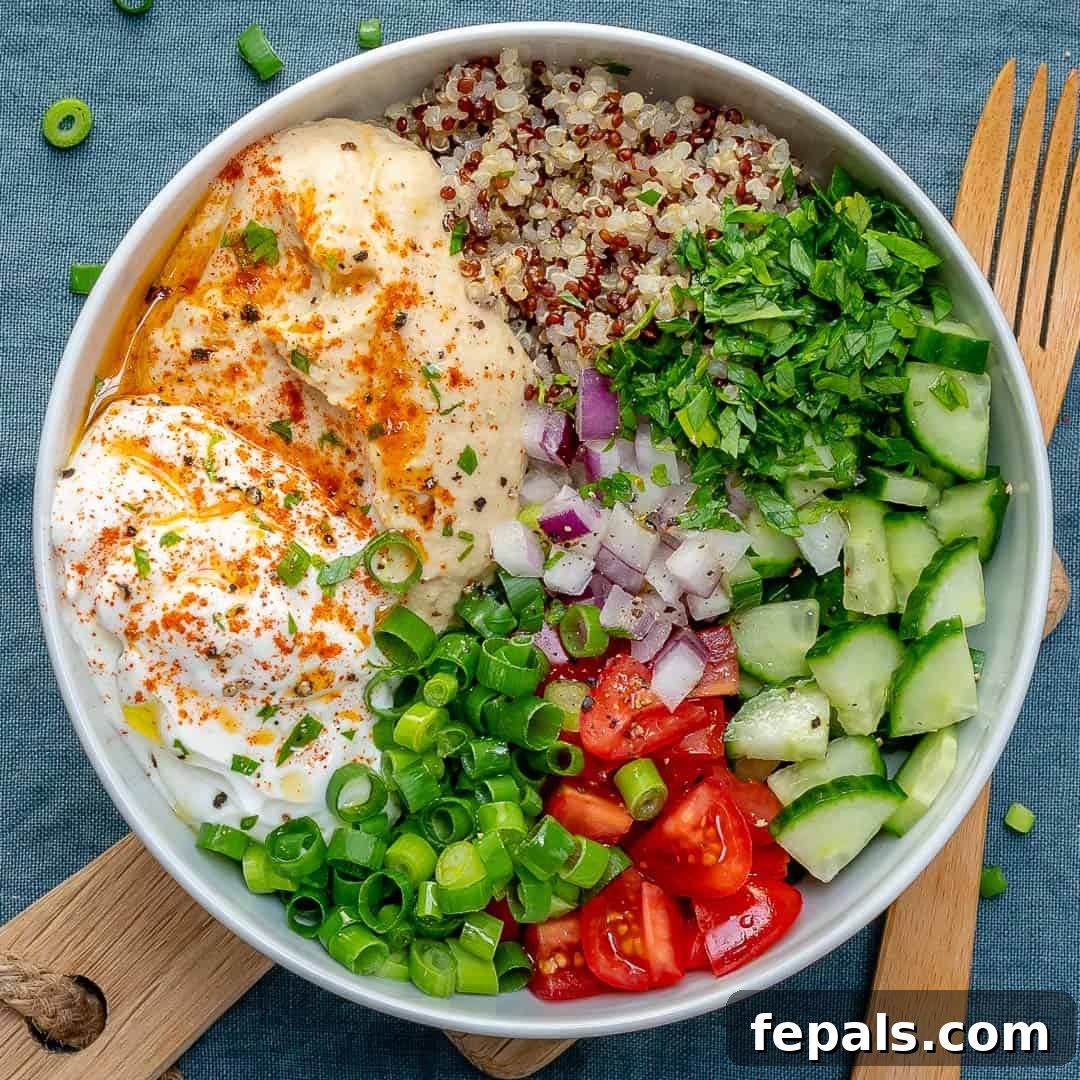 Plant-Powered Quinoa and Hummus Bowl 5 A close-up shot of the colorful quinoa and mixed vegetables in the bowl