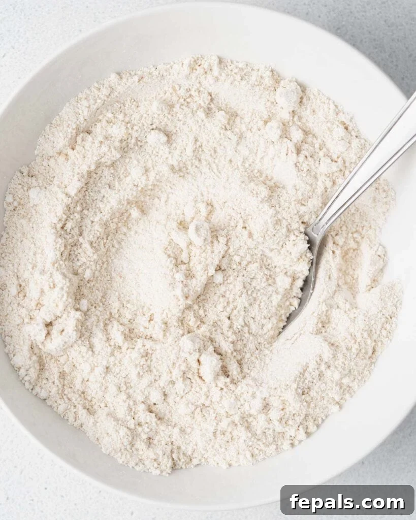 Wholesome Ready-to-Eat Cookie Dough 6 flour and sugar mixed together in a bowl