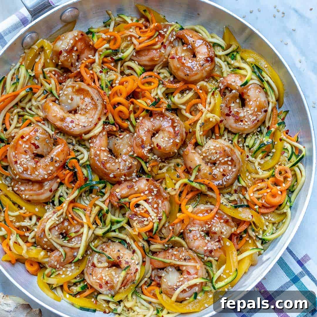 Vibrant Asian Shrimp Zoodle Stir-fry 4 A serving of Asian shrimp zoodles with fresh garnishes