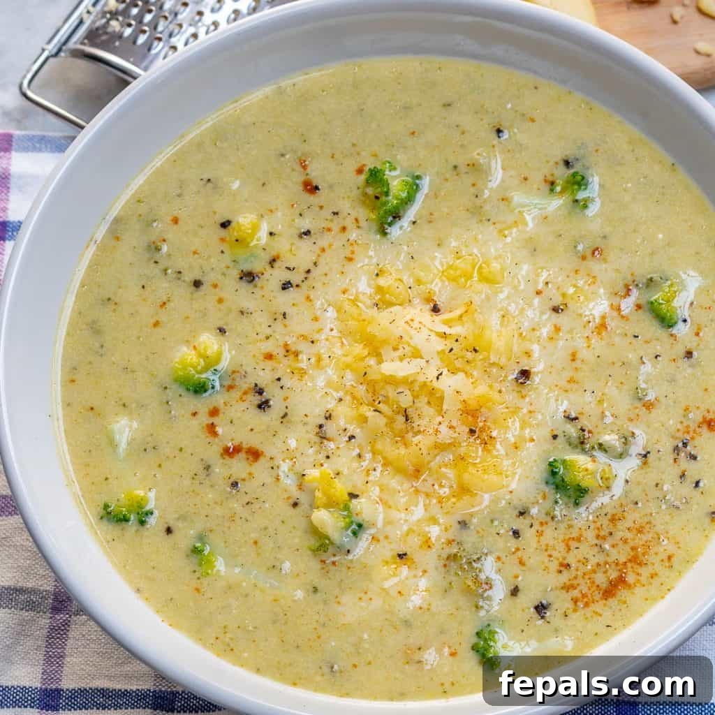 Wholesome Broccoli Cheddar Bliss 6 side view of a white bowl of Broccoli Cheddar Soup