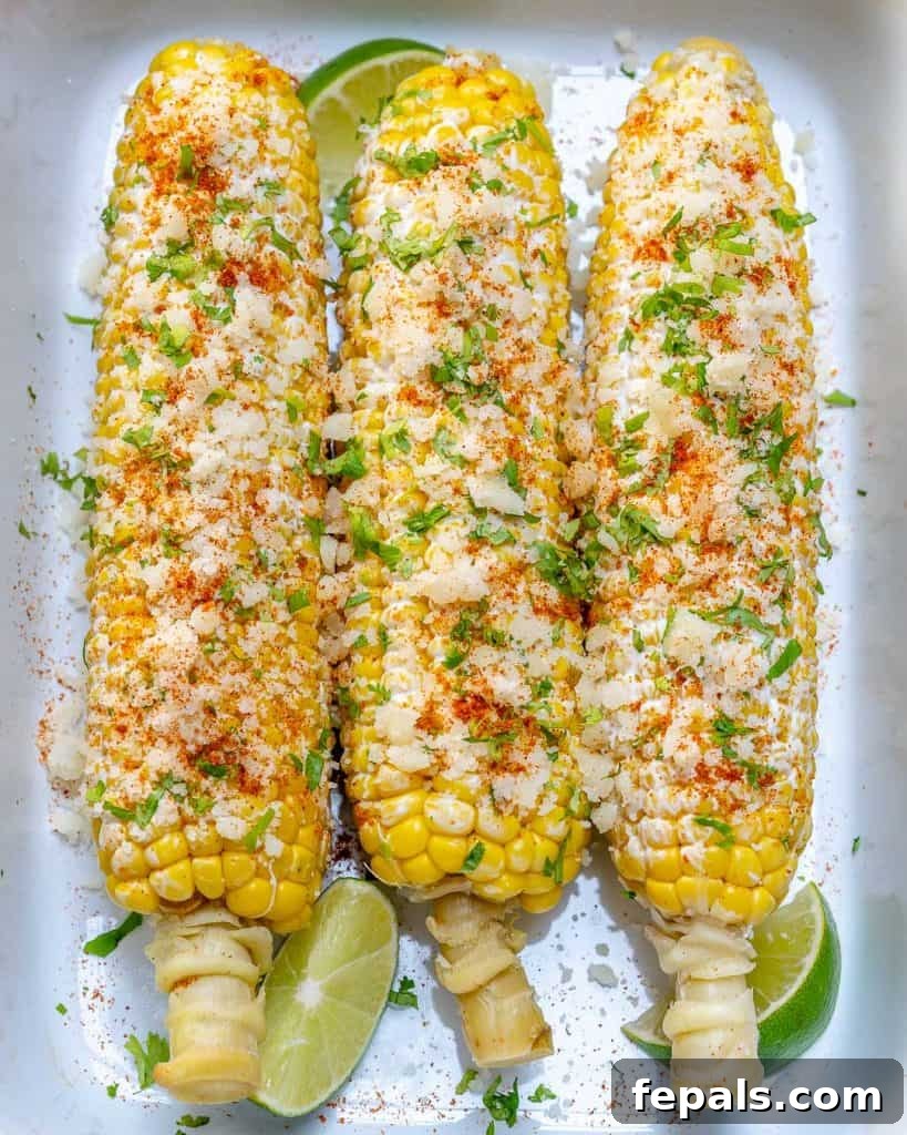 Effortless Elote 2 top view of 3 corn on the cob on a white plate
