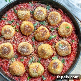 Gooey Cheesy Chicken Parm Meatballs 3 Chicken Parmesan Meatballs in Tomato Sauce - side view