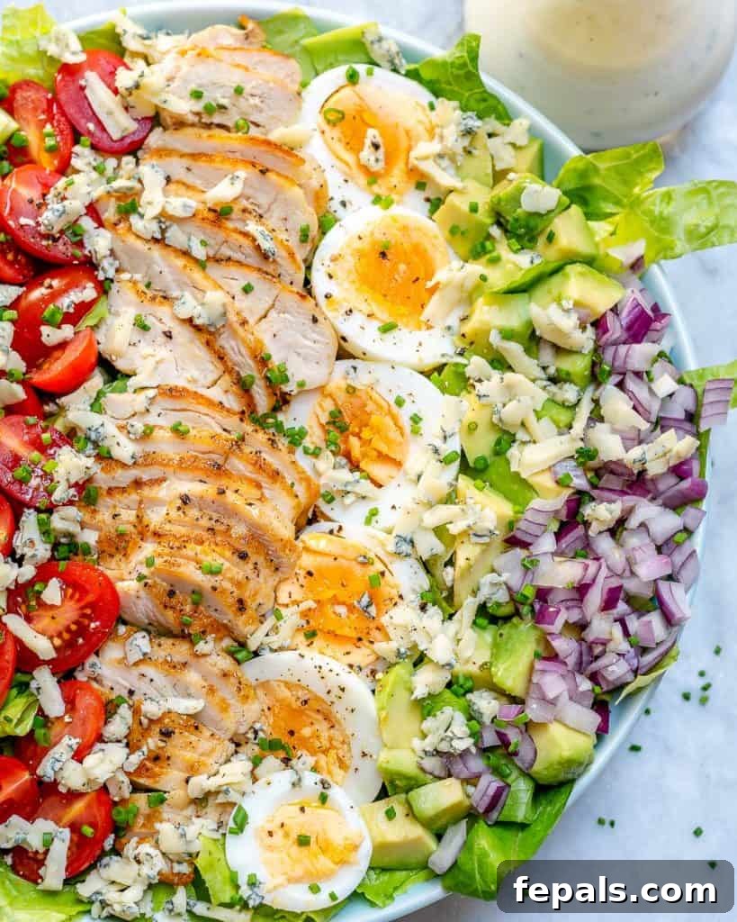 top view of half a bowl of chicken cobb salad 