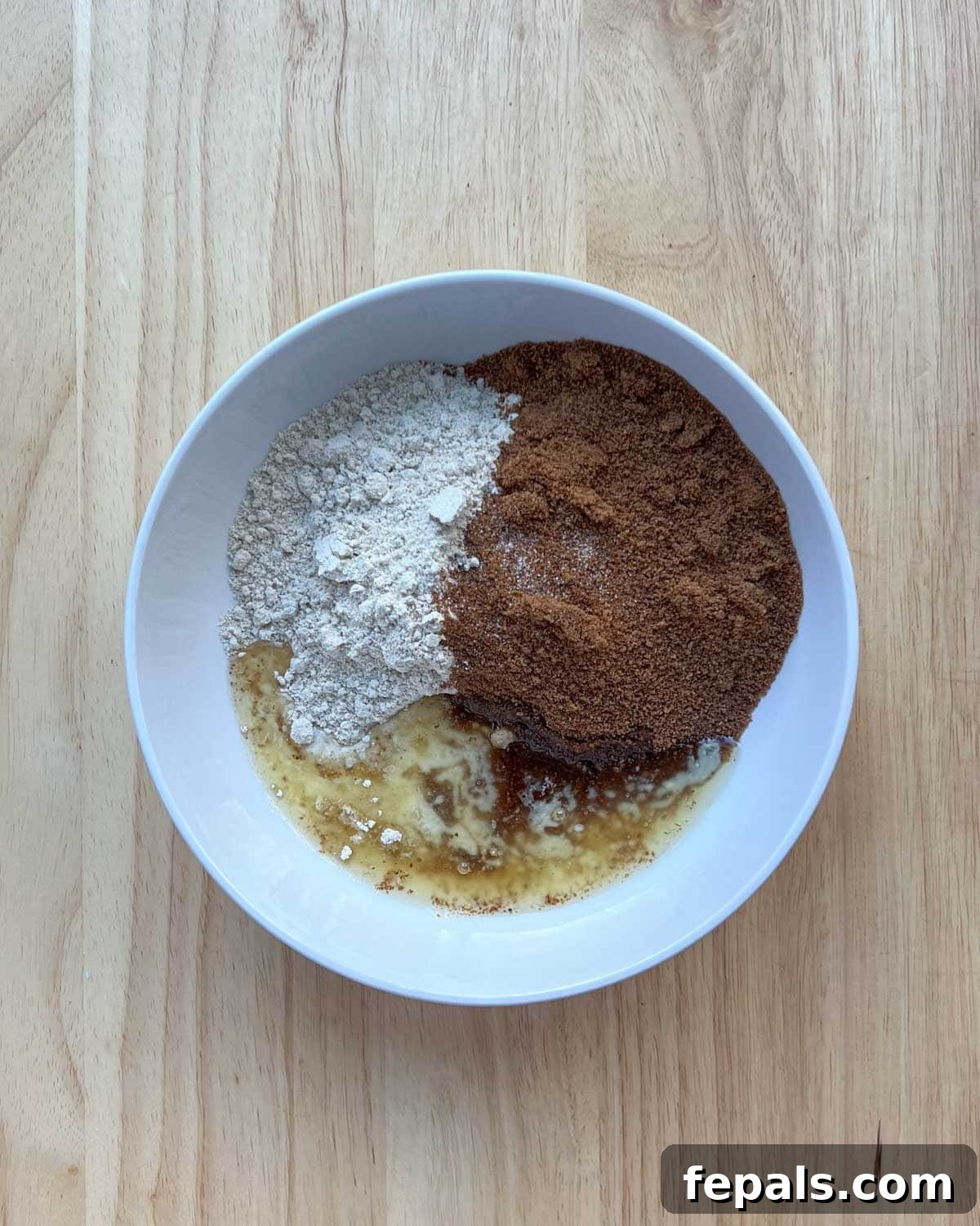 topping ingredients added to a bowl.