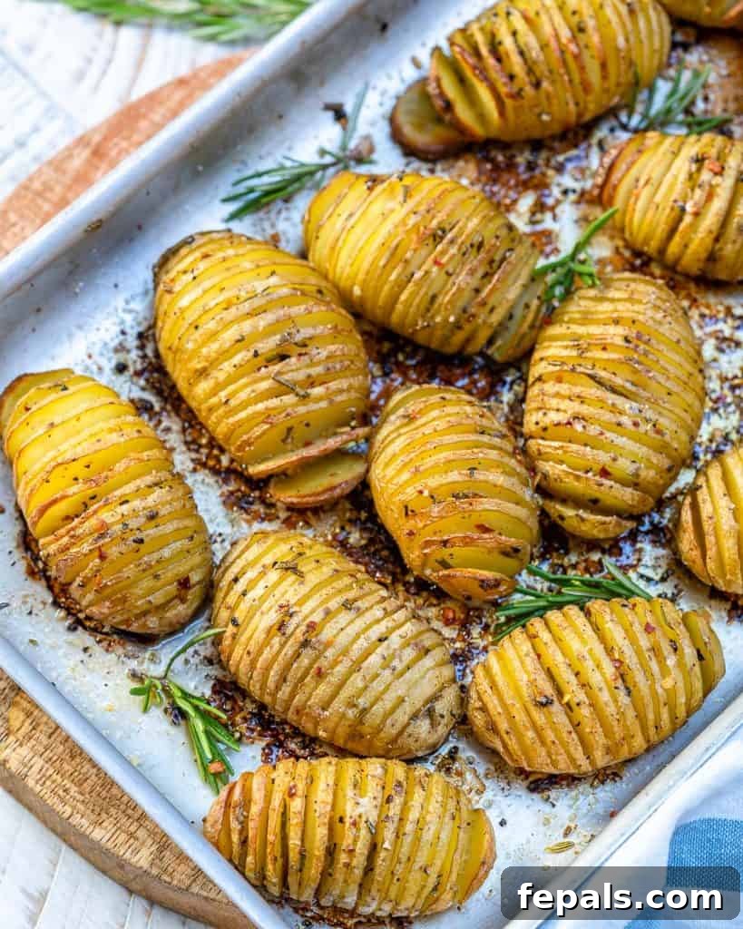 Golden Accordion Potatoes 6 side shot of baked hasselback potatoes on a sheet pan