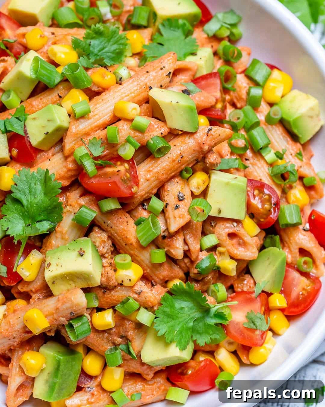 Fiesta Taco Pasta Salad 4 Close-up shot of a creamy and colorful Taco Pasta Salad, showcasing the ground turkey, pasta, and fresh vegetables.
