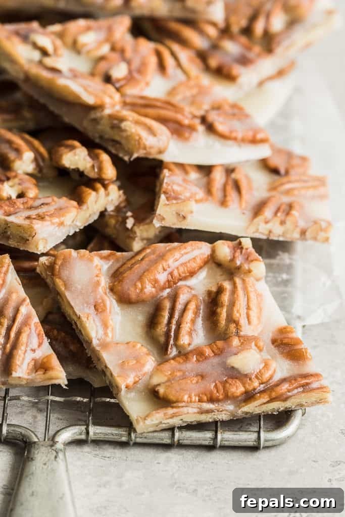 Keto Pecan Brittle square bars on a wire wrack cooling off