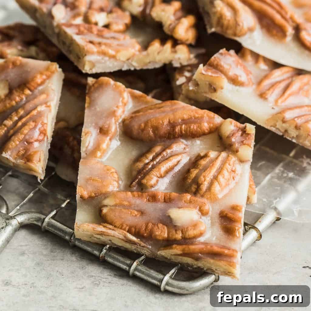 close up of pecan brittle on a wire wrack cooling
