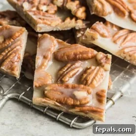 close up of pecan brittle on a wire wrack cooling