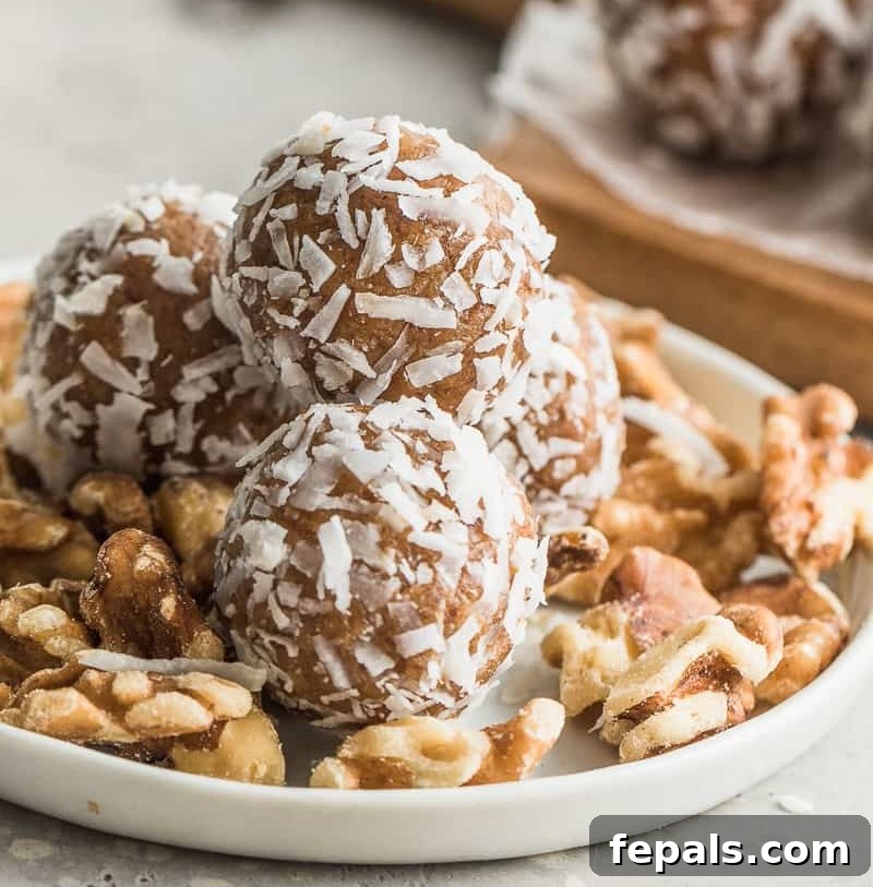 Side view of multiple date energy balls artfully arranged, highlighting their texture and presentation.