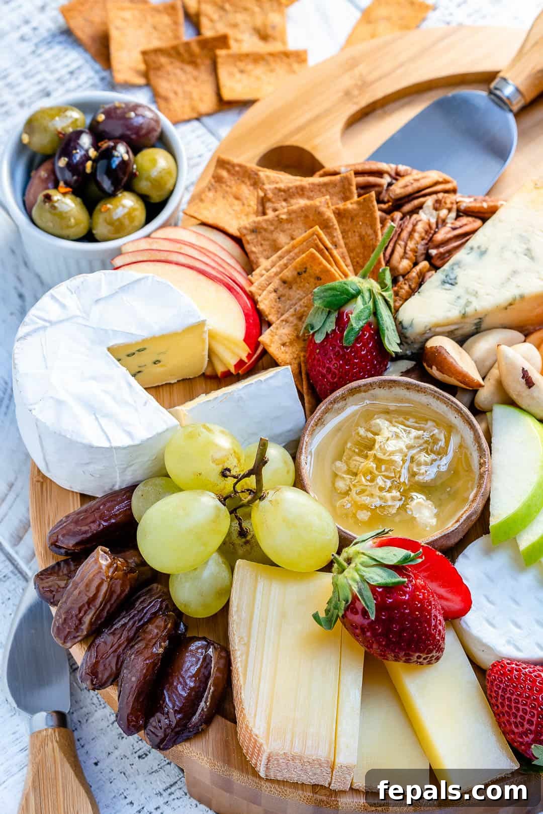 Mastering the Art of the Cheese Board 4 fruits and spread on table