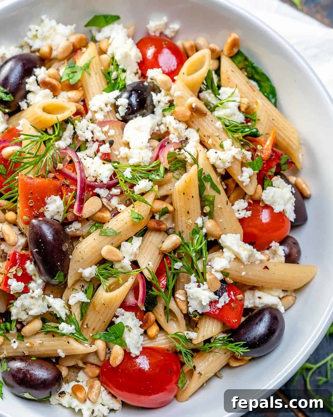 Fresh Greek Cherry Tomato Pasta 5 Greek Pasta with olives and cherry tomatoes in a large serving bowl