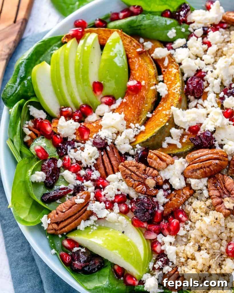 top view of a colorful quinoa salad artfully arranged in a white bowl