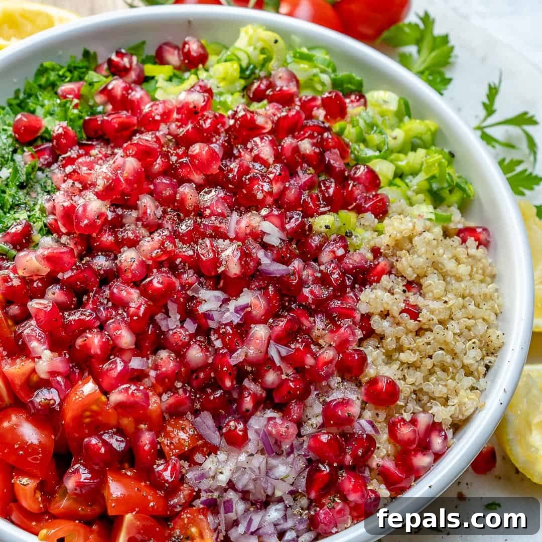 Vibrant Quinoa Tabbouleh Salad 3 Close-up of fresh ingredients for Quinoa Tabbouleh: chopped parsley, tomatoes, onions, and cooked quinoa