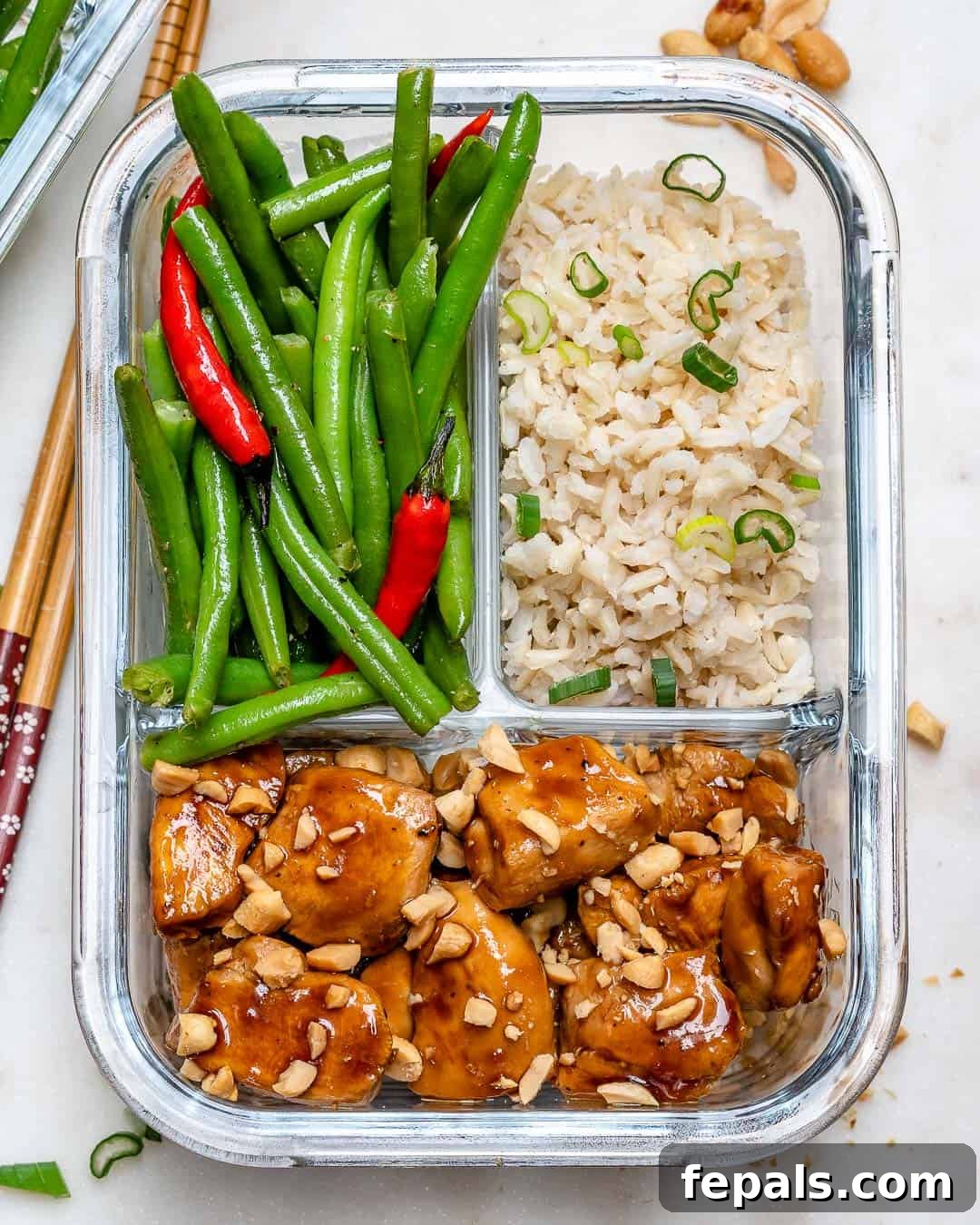 Sweet and Spicy Chicken in a meal prep container, ready to eat