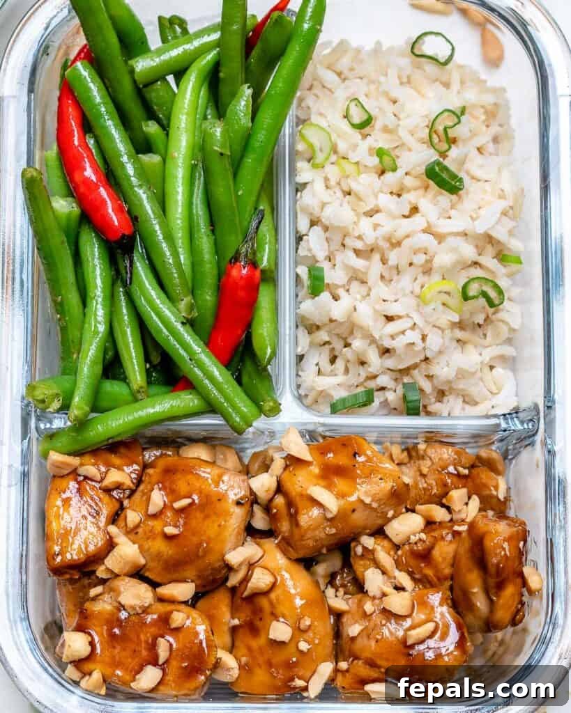 Close up view of the sweet and spicy chicken meal prep bowl, highlighting texture and vibrant ingredients.