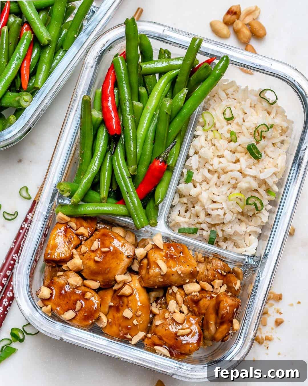 Delicious chicken, green beans, and brown rice perfectly portioned in a meal prep container, ready for a healthy meal.