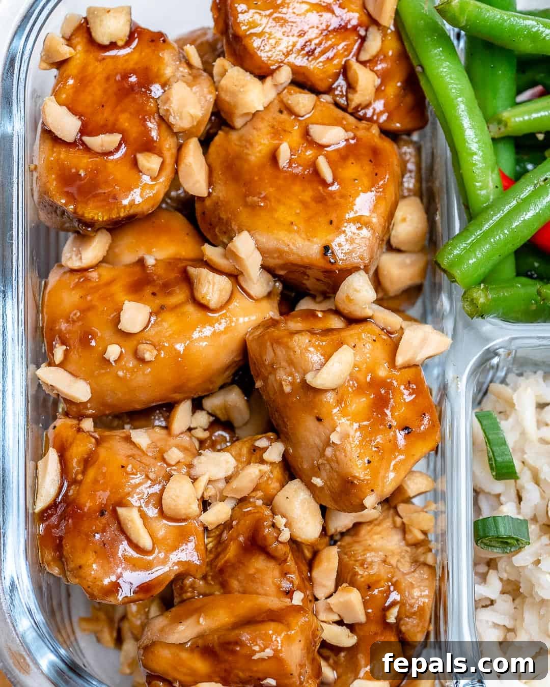 Top-down view of Sweet and Spicy Chicken garnished with crumbled peanuts, ready for serving.