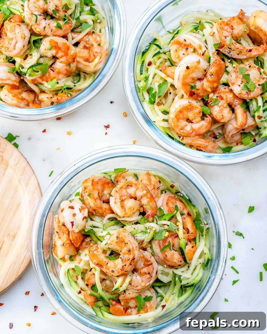 Flavor Burst Shrimp 3 3 bowls with sauteed shrimp and zoodles.