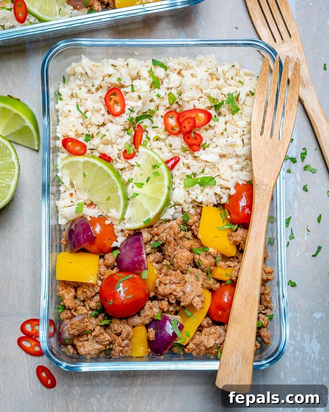 Ground Turkey and Cauliflower Rice Skillet Ground turkey recipe in a glass container with cauliflower rice, emphasizing a healthy and convenient meal solution.