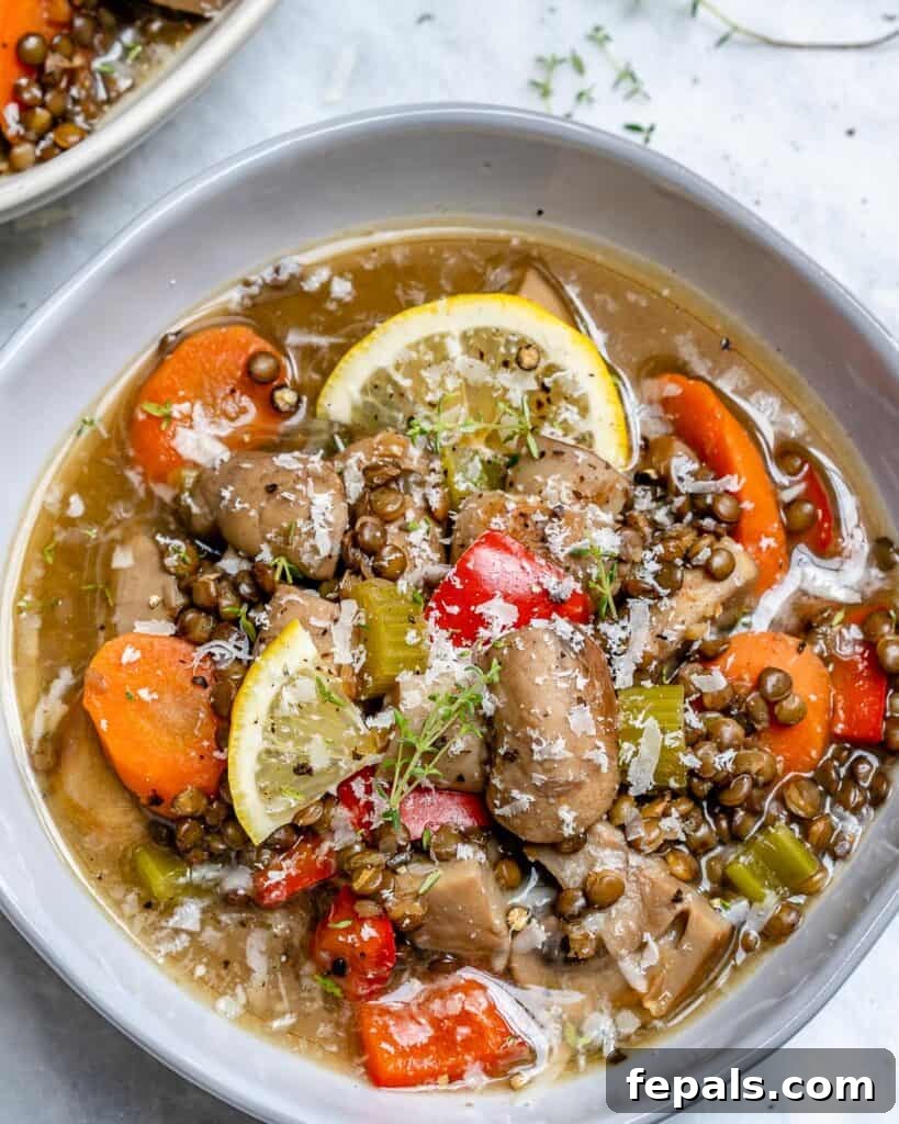 top view of mushroom soup recipe with lentil and carrots in a bowl