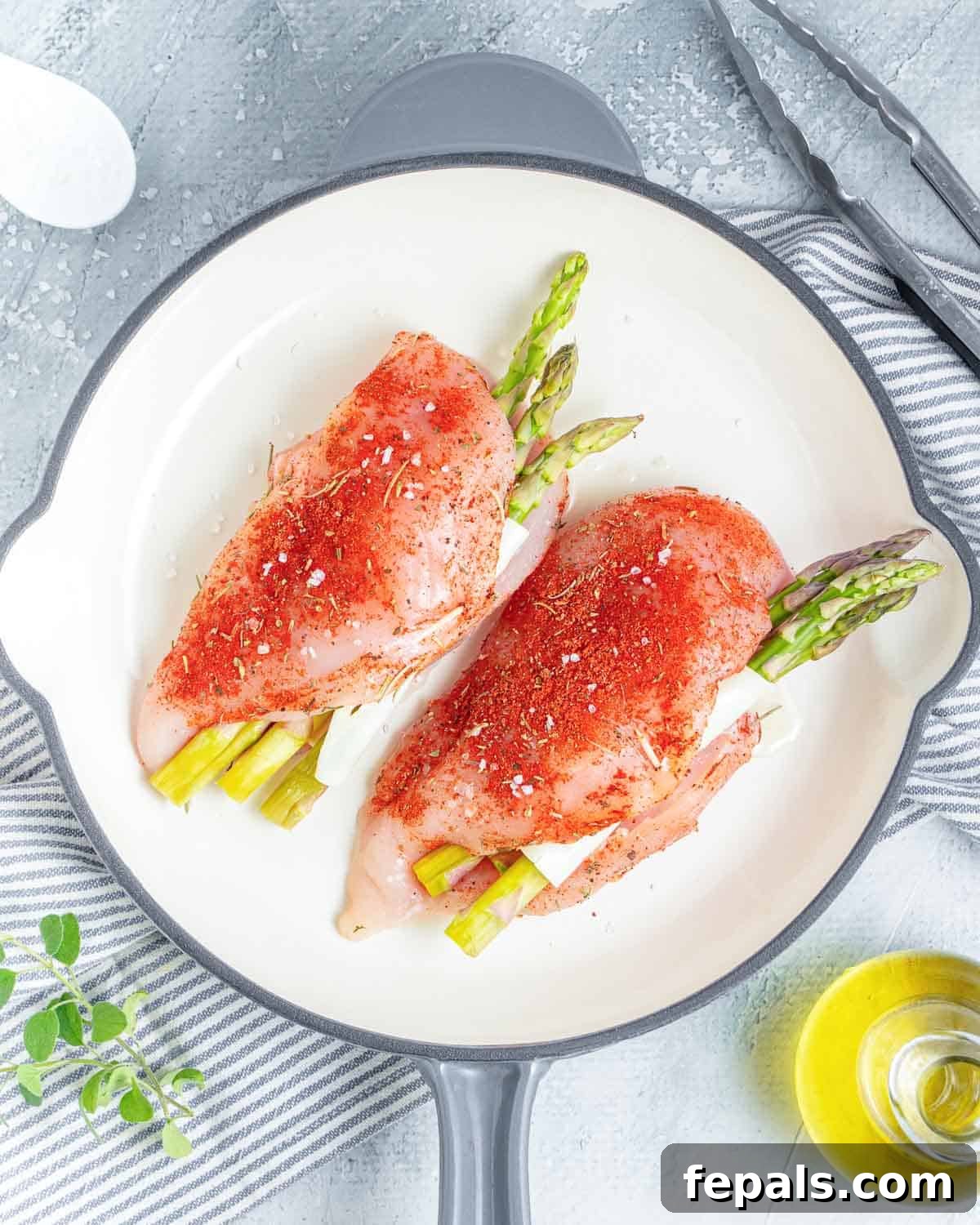 chicken breast uncooked placed on a skillet.