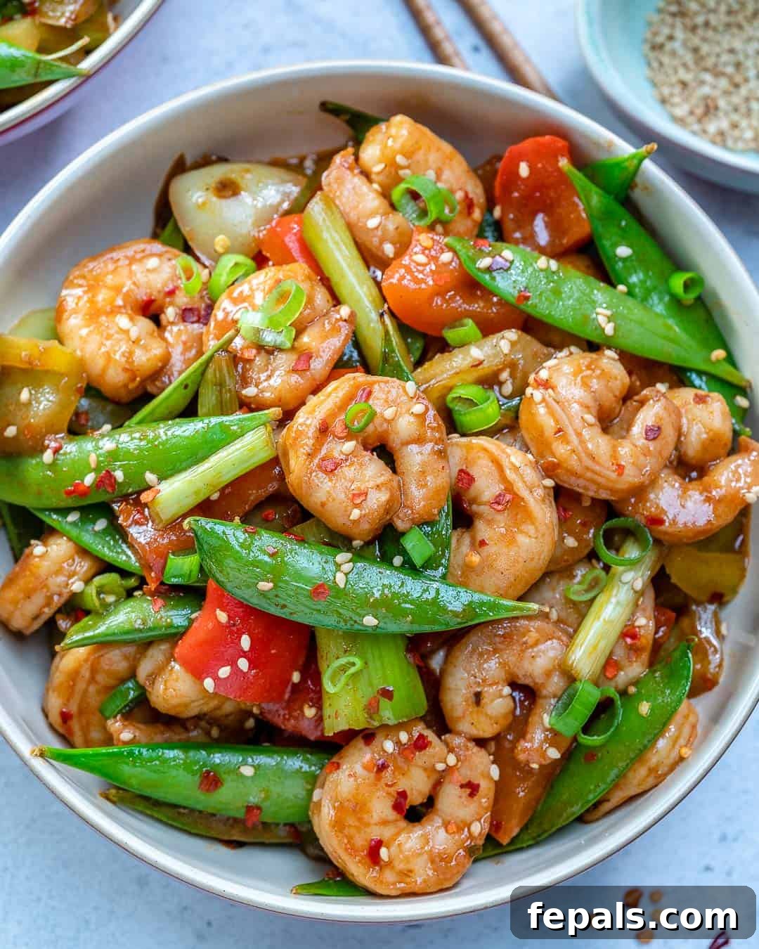 Vibrant Szechuan shrimp stir-fry with crisp vegetables in a bowl, ready to be served.