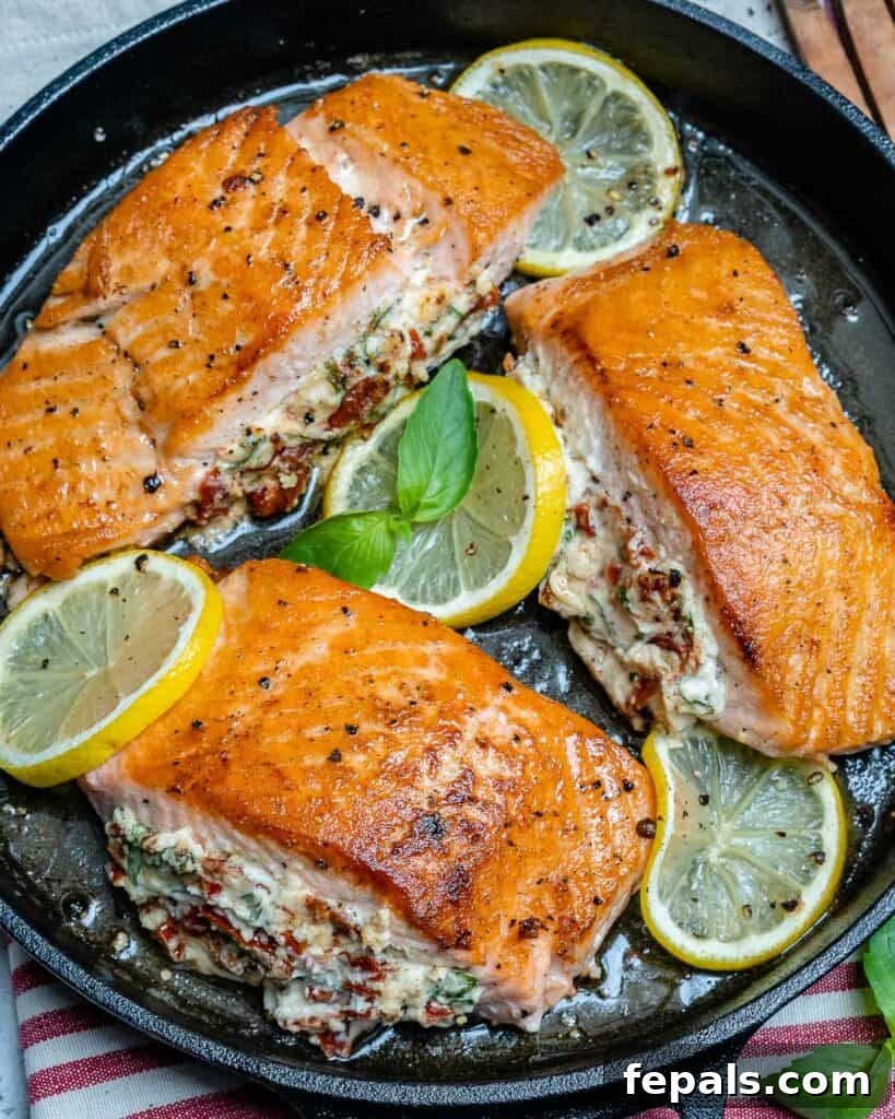 top view of pan-seared stuffed salmon in a skillet