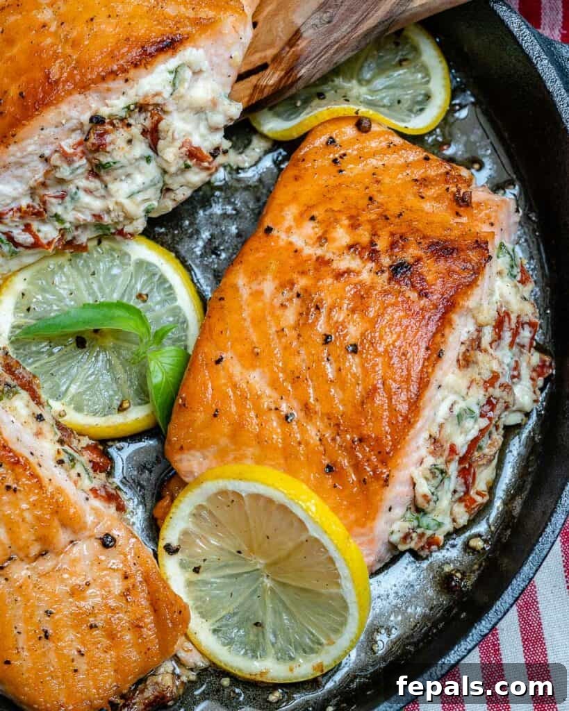 top view of pan-seared stuffed salmon in a skillet