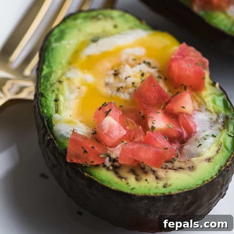 Avocado Egg Nests 4 Baked egg in half an avocado topped with chopped tomatoes.