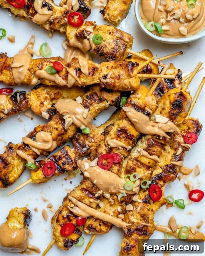 top view of thai grilled chicken recipe with a drizzle of peanut sauce