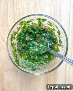 Chargrilled Cauliflower Steaks with Fresh Chimichurri 12 chimichurri sauce mixed in a bowl.