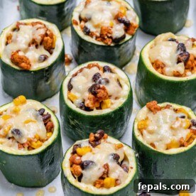 Melted cheese added over Taco Stuffed Zucchini Cups.