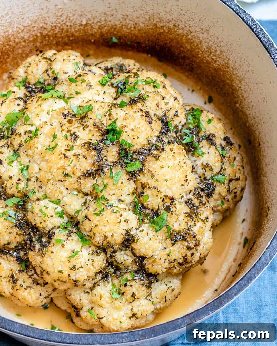 Garlic roasted cauliflower head for a healthy meal