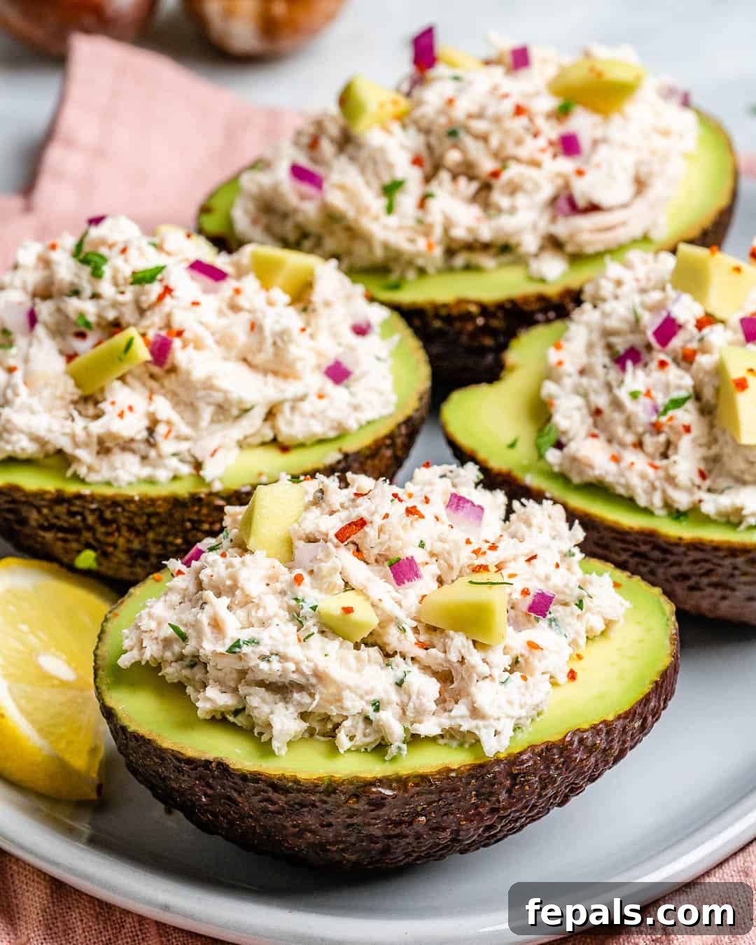 Wholesome Chicken Salad Avocado Boats 4 Keto chicken salad recipe, highlighting the low-carb avocado serving option.