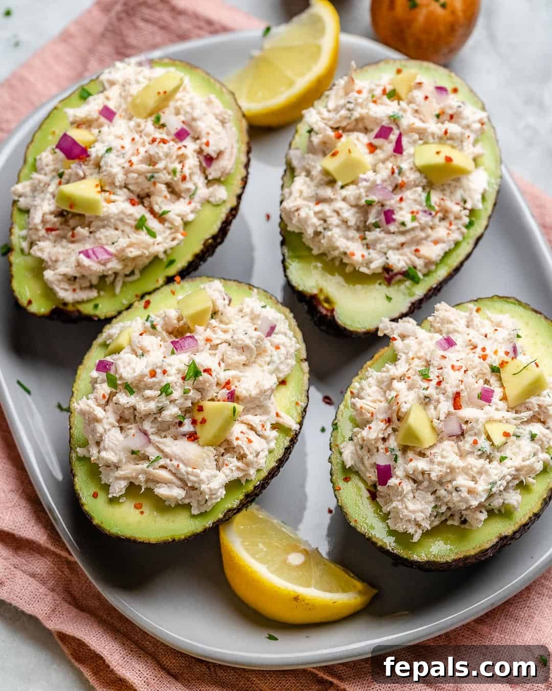 Wholesome Chicken Salad Avocado Boats 9 Overhead shot of stuffed avocados, showing the fresh ingredients and presentation.