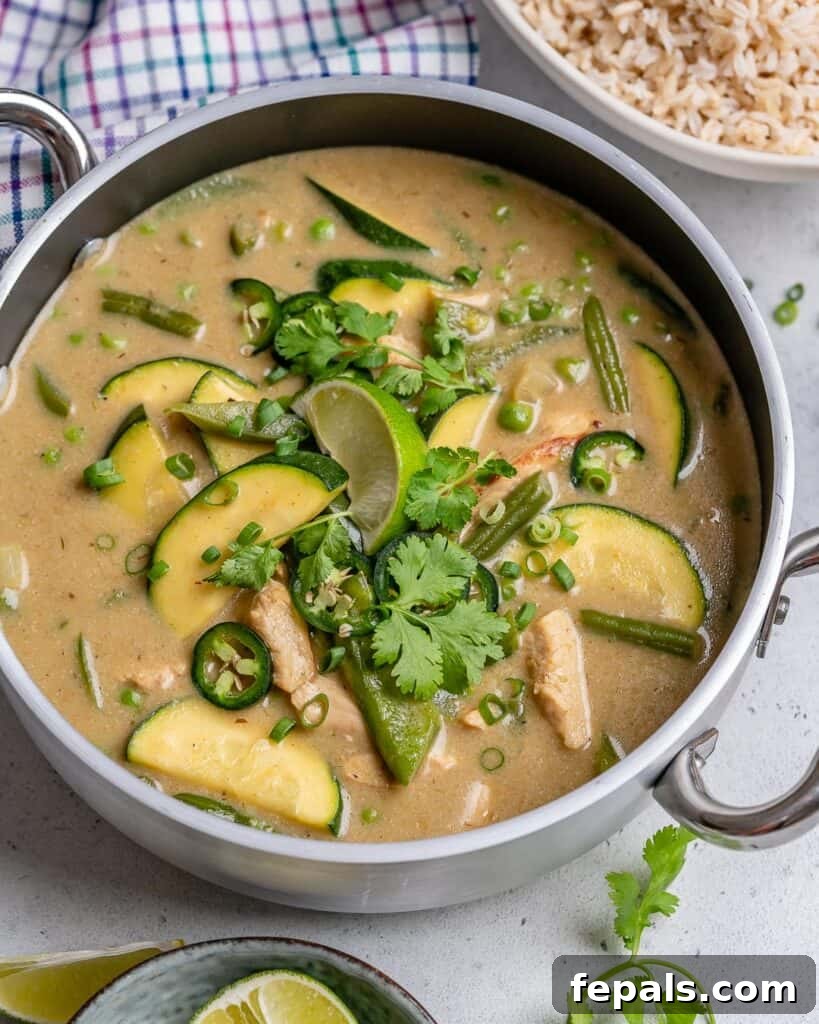 chicken curry recipe in a pan that is mostly green in color 