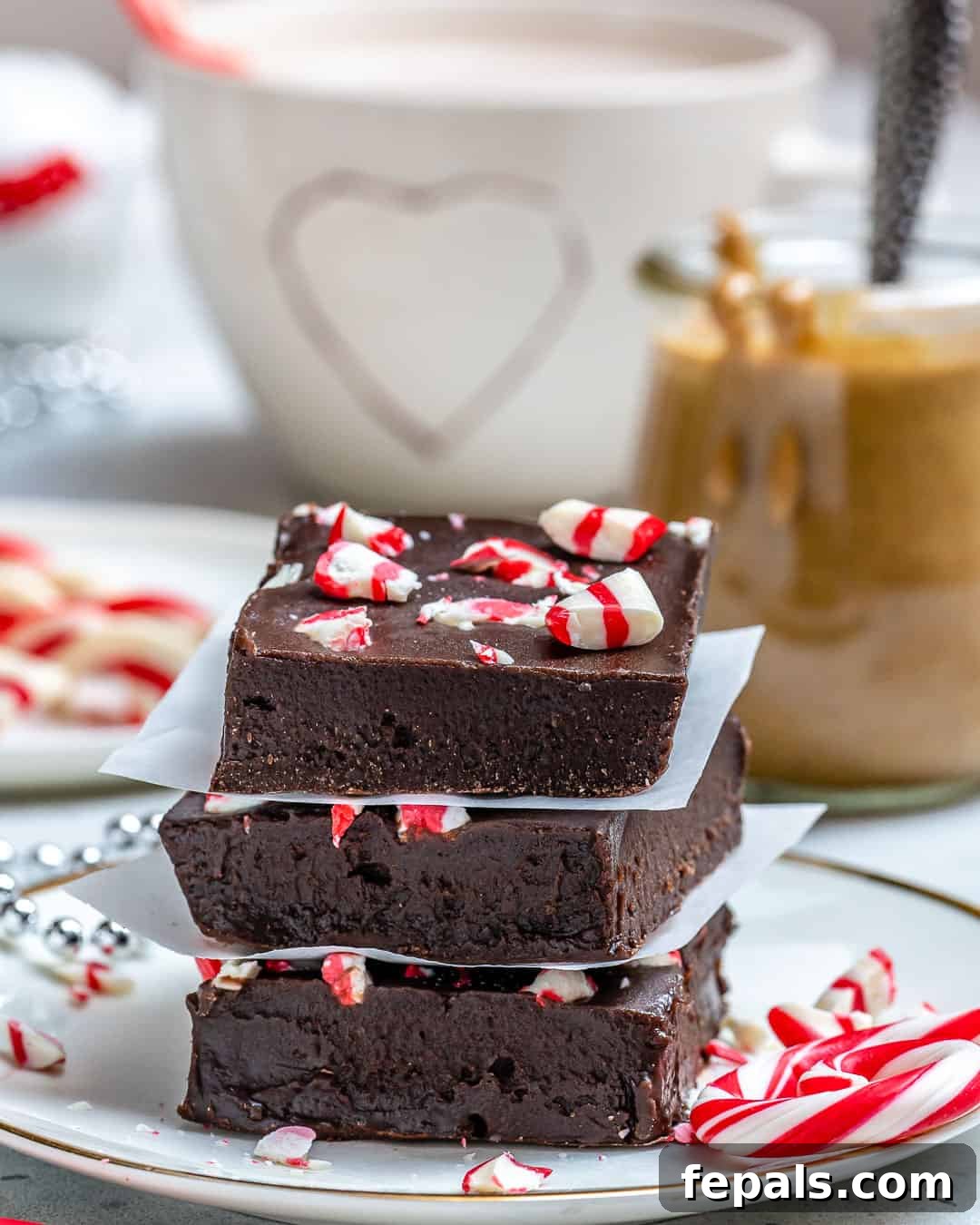 Three perfectly formed squares of peppermint fudge, arranged elegantly.