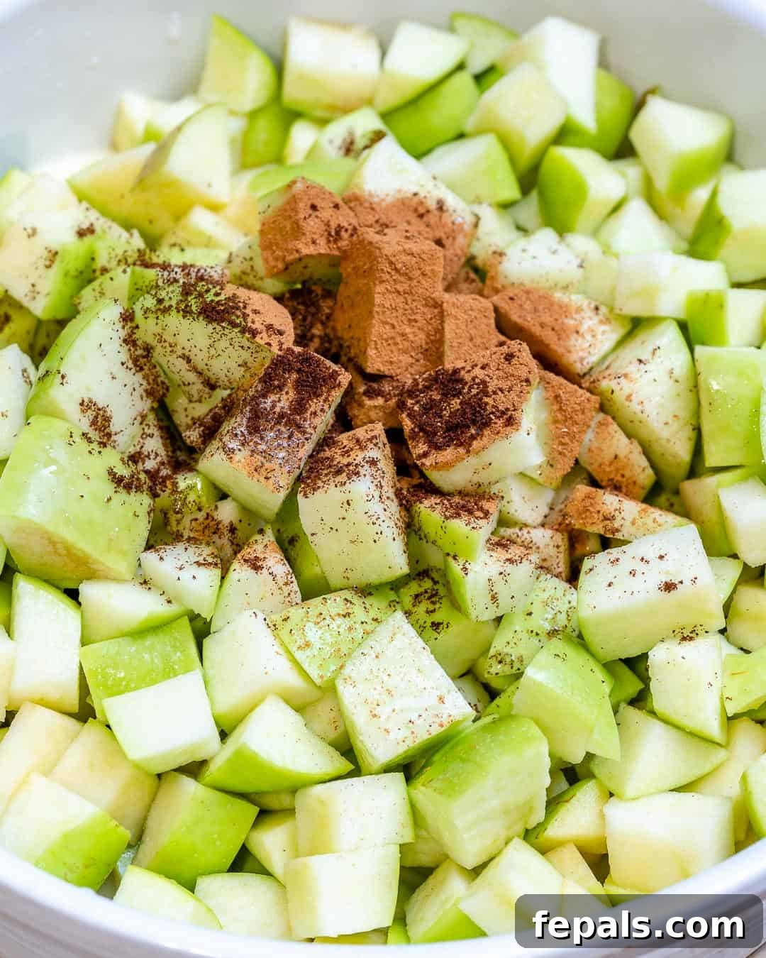chopped apples with cornstarch and cinnamon, apple filling