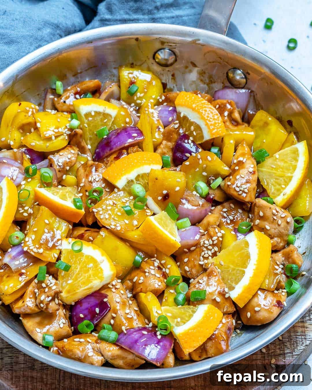 Healthy and easy orange chicken stir fry recipe served in a bowl