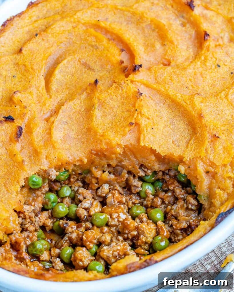 Wholesome Sweet Potato Shepherd's Pie 11 close up view of a portion take off sweet potato shepherd's pie from a dish