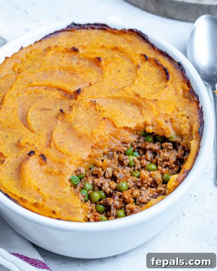 Wholesome Sweet Potato Shepherd's Pie 3 side shot of a white dish with sweet potato shepherds pie