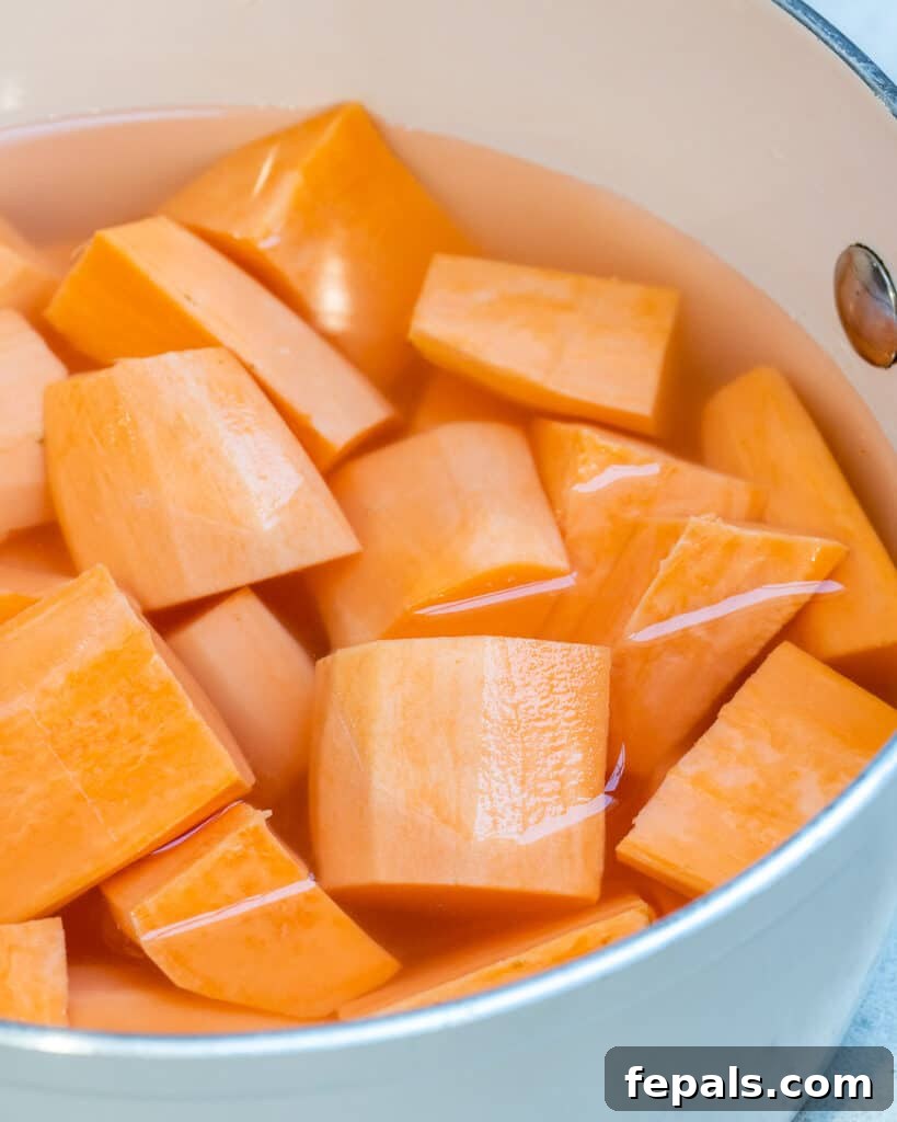 Wholesome Sweet Potato Shepherd's Pie 5 chopped sweet potatoes in a bowl full of water