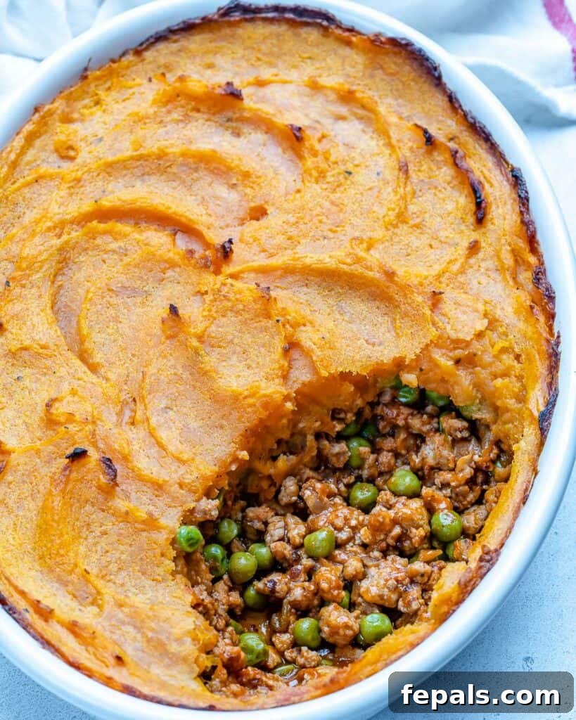 Wholesome Sweet Potato Shepherd's Pie 10 oval dish with shepherd's pie made with sweet potatoes
