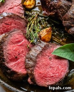 Aromatic Garlic Beef Tenderloin 15 Sliced tenderloins on a skillet