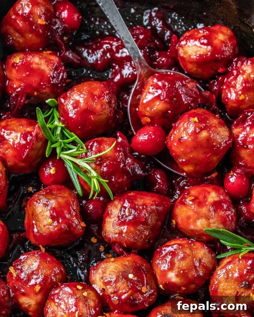 close up cranberry sauce chicken meatballs in a pan