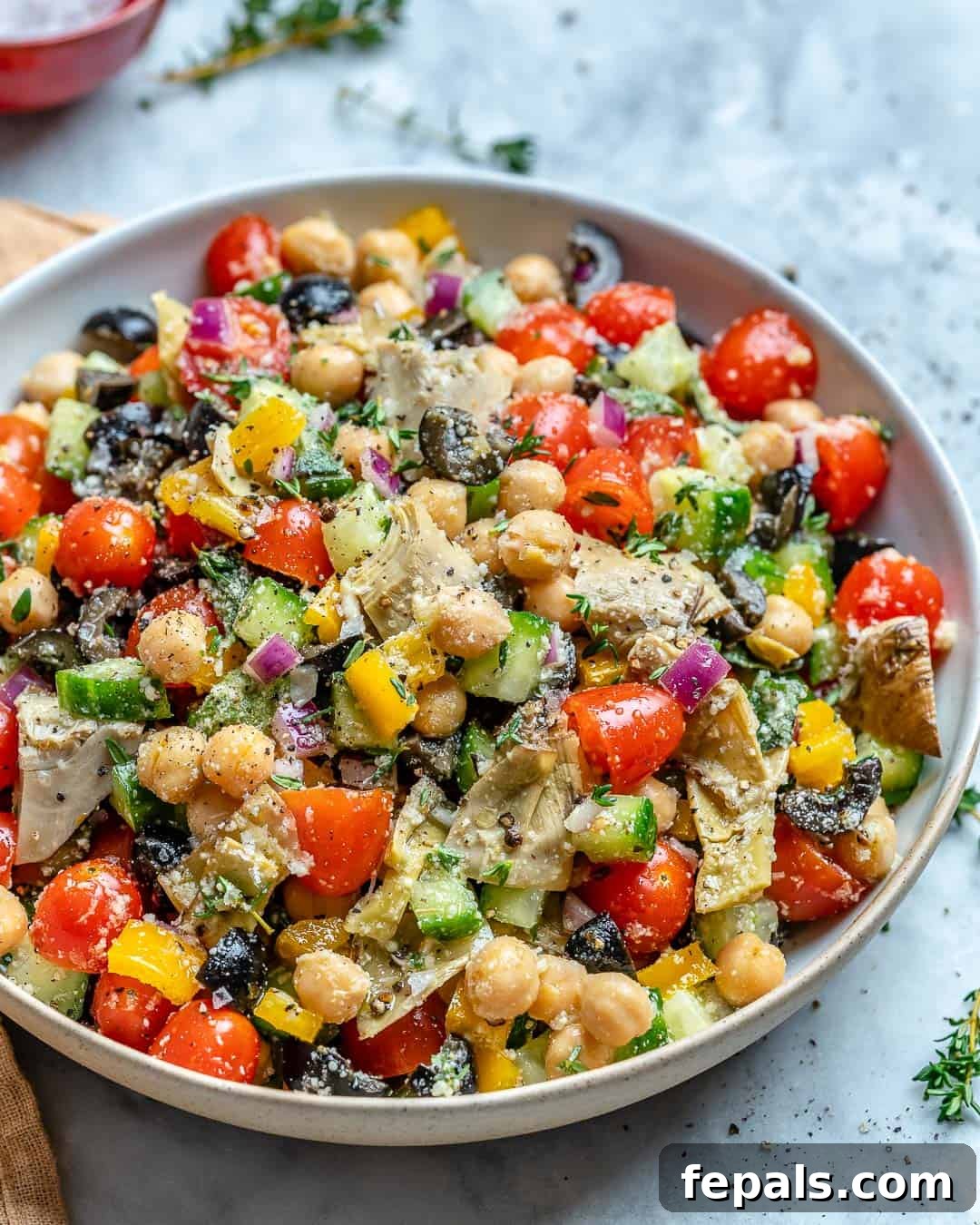Vibrant Mediterranean chickpea salad recipe featuring fresh vegetables.