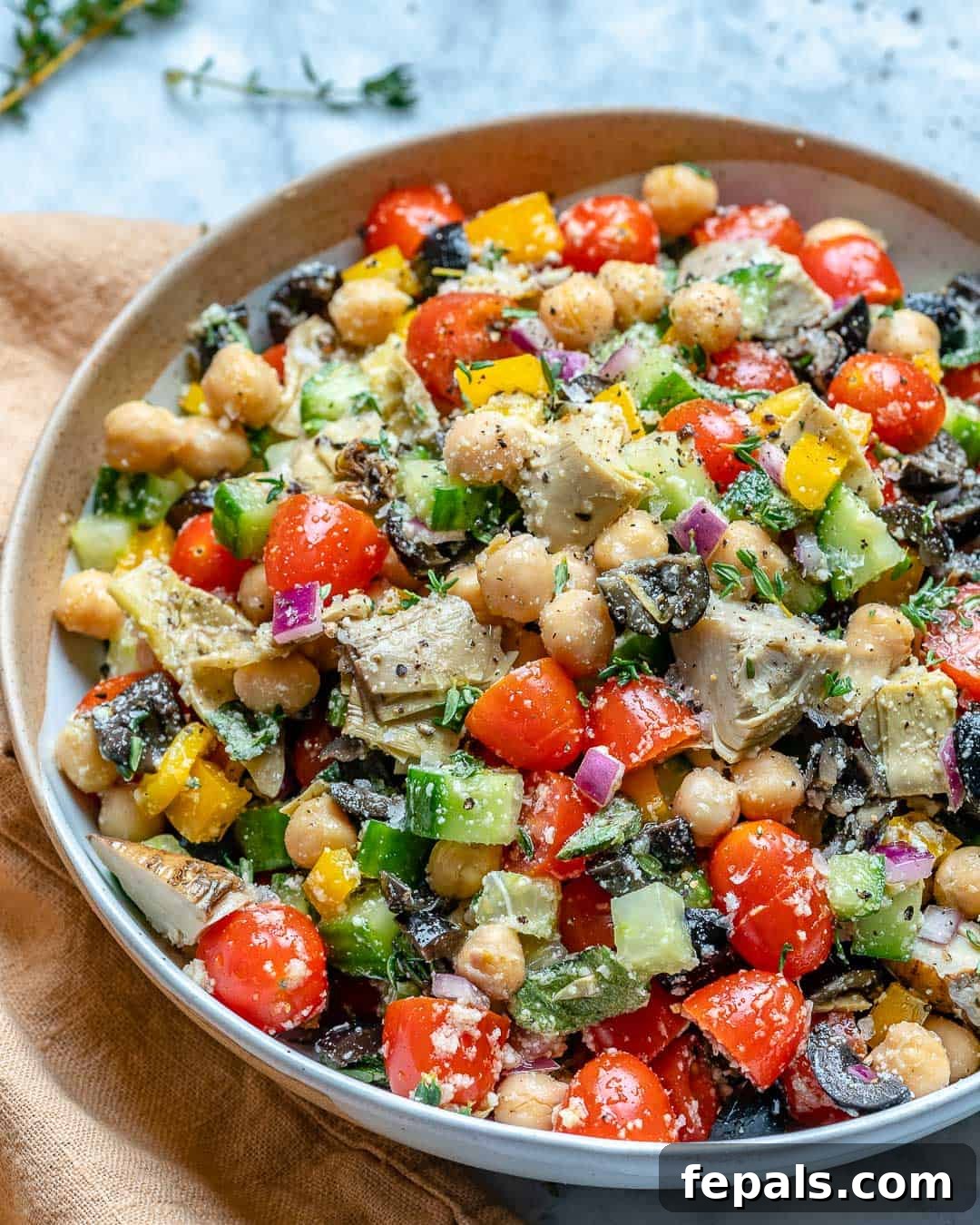 Healthy chickpea salad recipe with feta cheese and artichoke hearts.
