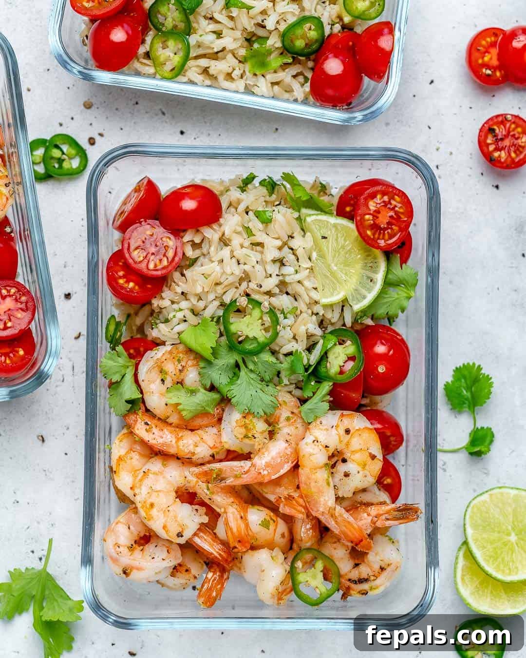 Flavorful Garlic Shrimp Meal Prep 6 Sautéed garlic shrimp recipe served with brown rice and fresh tomatoes, ready for a healthy meal.